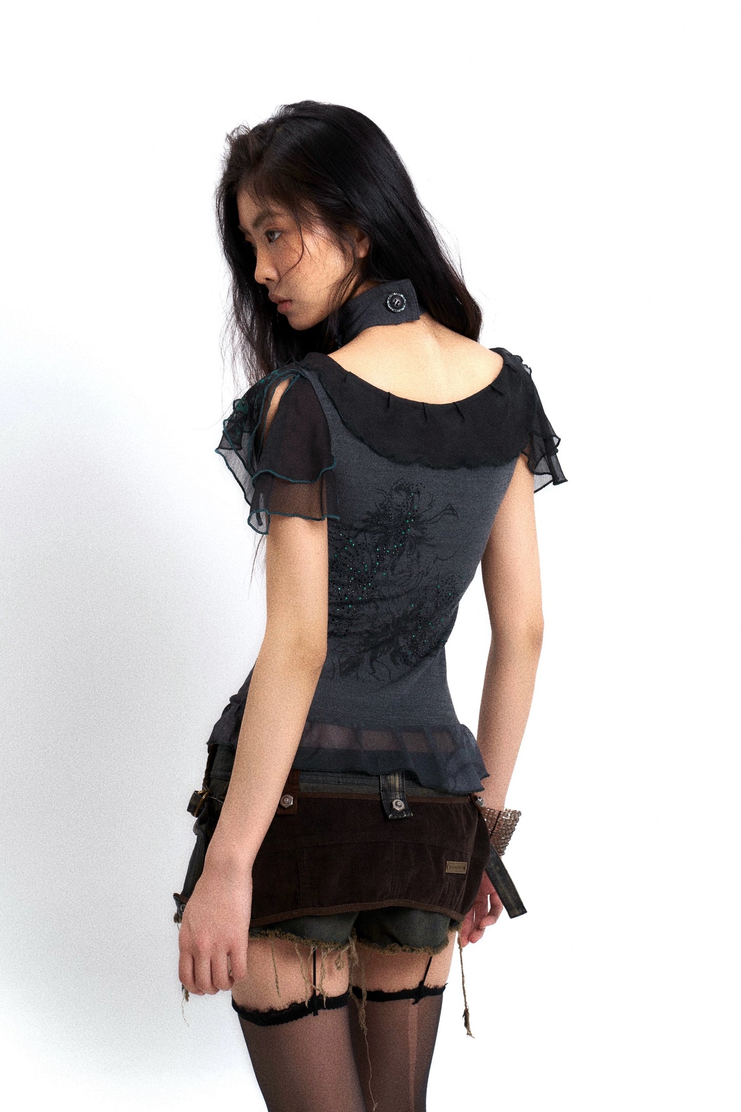 Washed distressed denim low-rise jeans with frayed edges